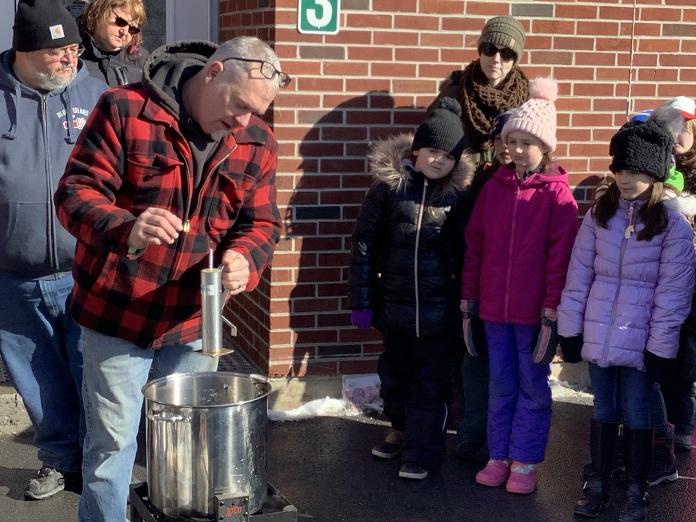 D. Reyell teaches 2nd graders about syrup-making